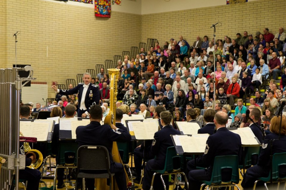 Col. A. Phillip Waite conducts the USAF Concert Band in fronted of a packed house during a matinee concert in Bozeman, Mont.