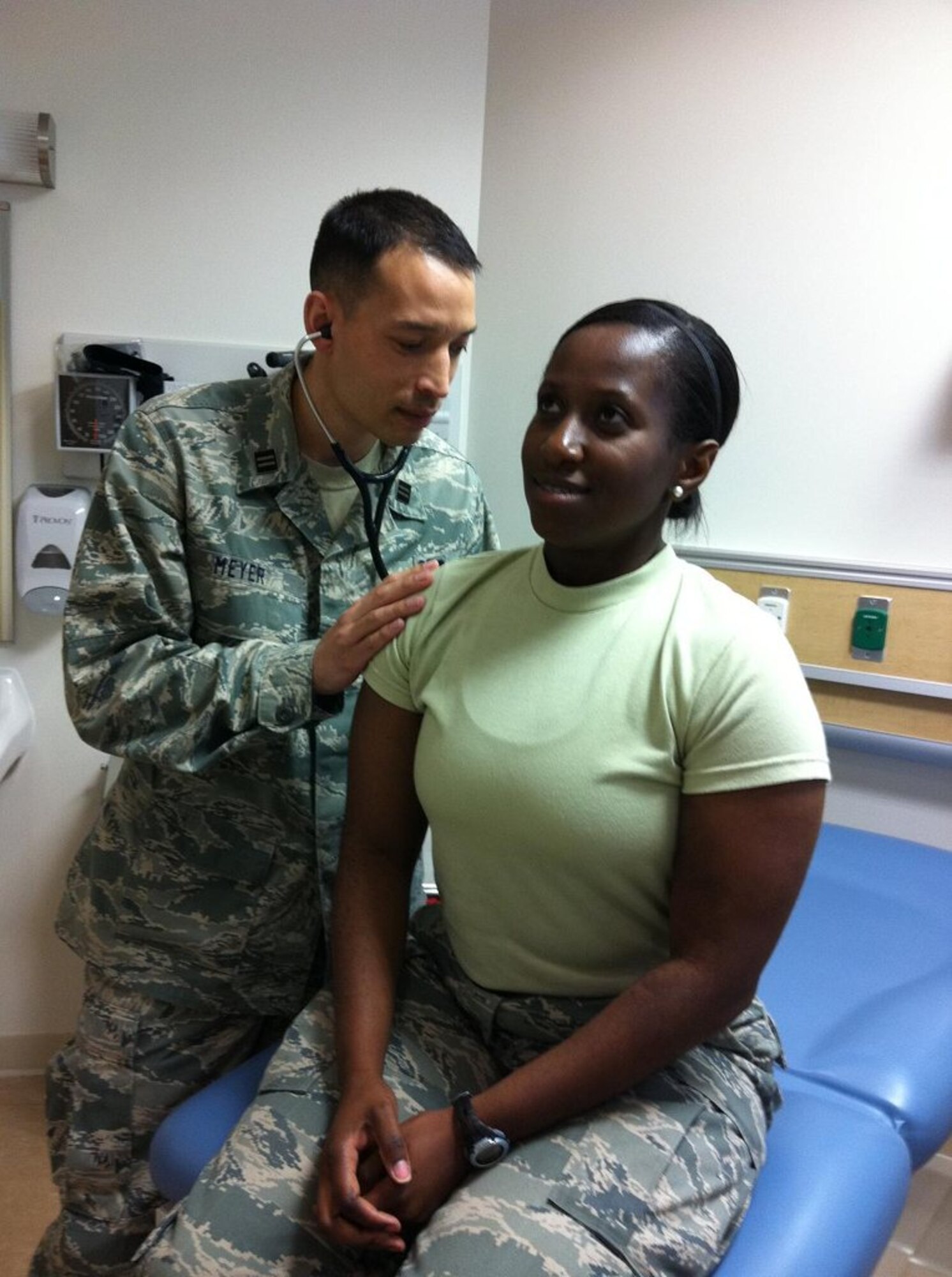 Officer in Training Jamie Meyer (left) conducts a check up on 1st Lt. Kimberly Bertrand Meyer during training for the physician assistant program at USAF Hospital Langley. National PA week was Oct. 6 through Wednesday. (Courtesy photo)