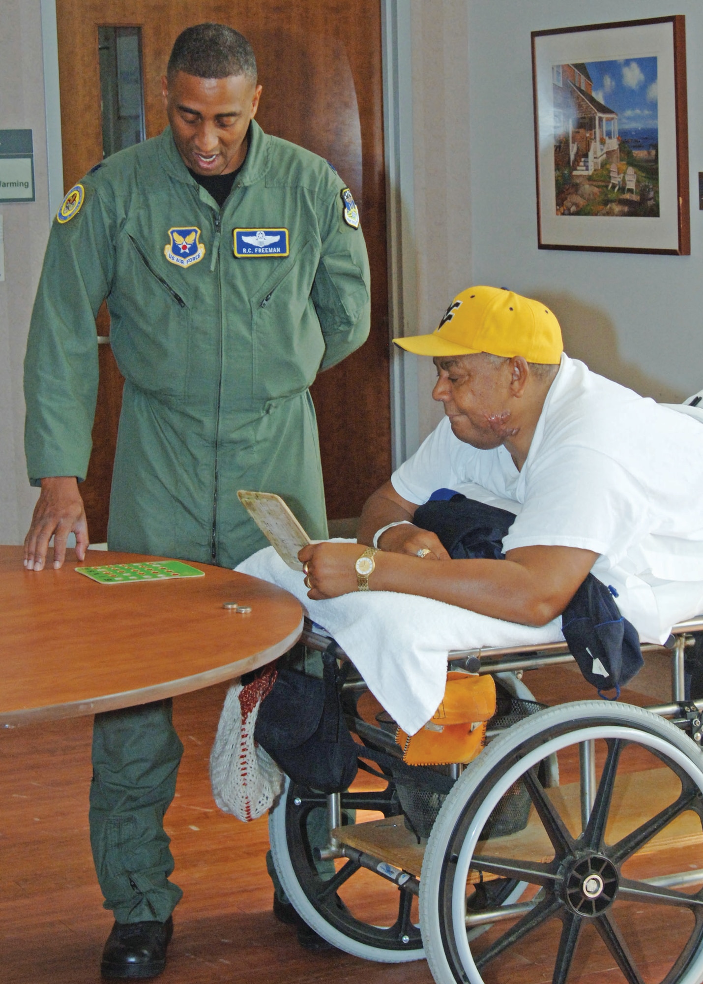 Air Force Lt. Col. Richard Freeman, left, and Lazarus Mosley discuss their bingo game at the Hampton Veterans Administration Medical Center Oct. 3. (U.S. Army photo by Patricia Radcliffe/RELEASED)