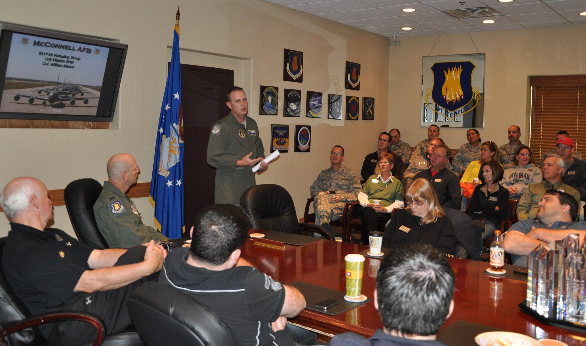 Col. William H. Mason, Commander, 931st Air Refueling Group, briefs honorary commanders at McConnell Air Force Base about the Air Force Reserve and 931st ARG mission during a flight brief, Oct. 13. The honorary commanders were preparing to fly aboard a KC-135 for an orientation flight.(Air Force photo by 1st Lt. Zach Anderson)