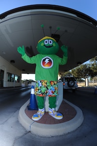 Randolph's energy awareness mascot, Sunny Greenwatts, greets incoming traffic at the main gate, Oct. 3.
U.S. Air Force photo Rich McFadden