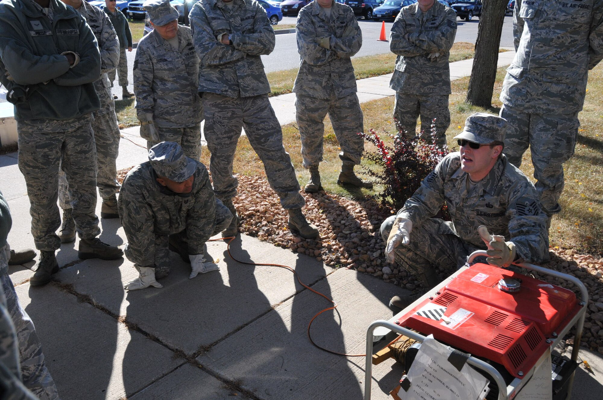Tech. Sgt. John Dufrense, 934th Force Support Squadron, trains FSS Airmen on setting up a generator during their exercise Oct.1.  The generator provides power for the Single Pallet Expeditionary Kitchen which is used to feed Airmen at deployed locations. (Air Force Photo/Tech. Sgt. Jeffrey Williams).