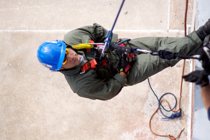 Firefighter Staff Sgt. John Williams from the 166th Civil Engineer Squadron, Delaware Air National Guard rappels down a building as part of training with fellow unit members as they hone their technical rescue skills at the Delaware State Fire School in Dover, Del. on Sept. 27, 2011. This technique is used to transport an injured person from a tall building. (U.S. Air Force photo/Tech. Sgt. Lionel Castellano)