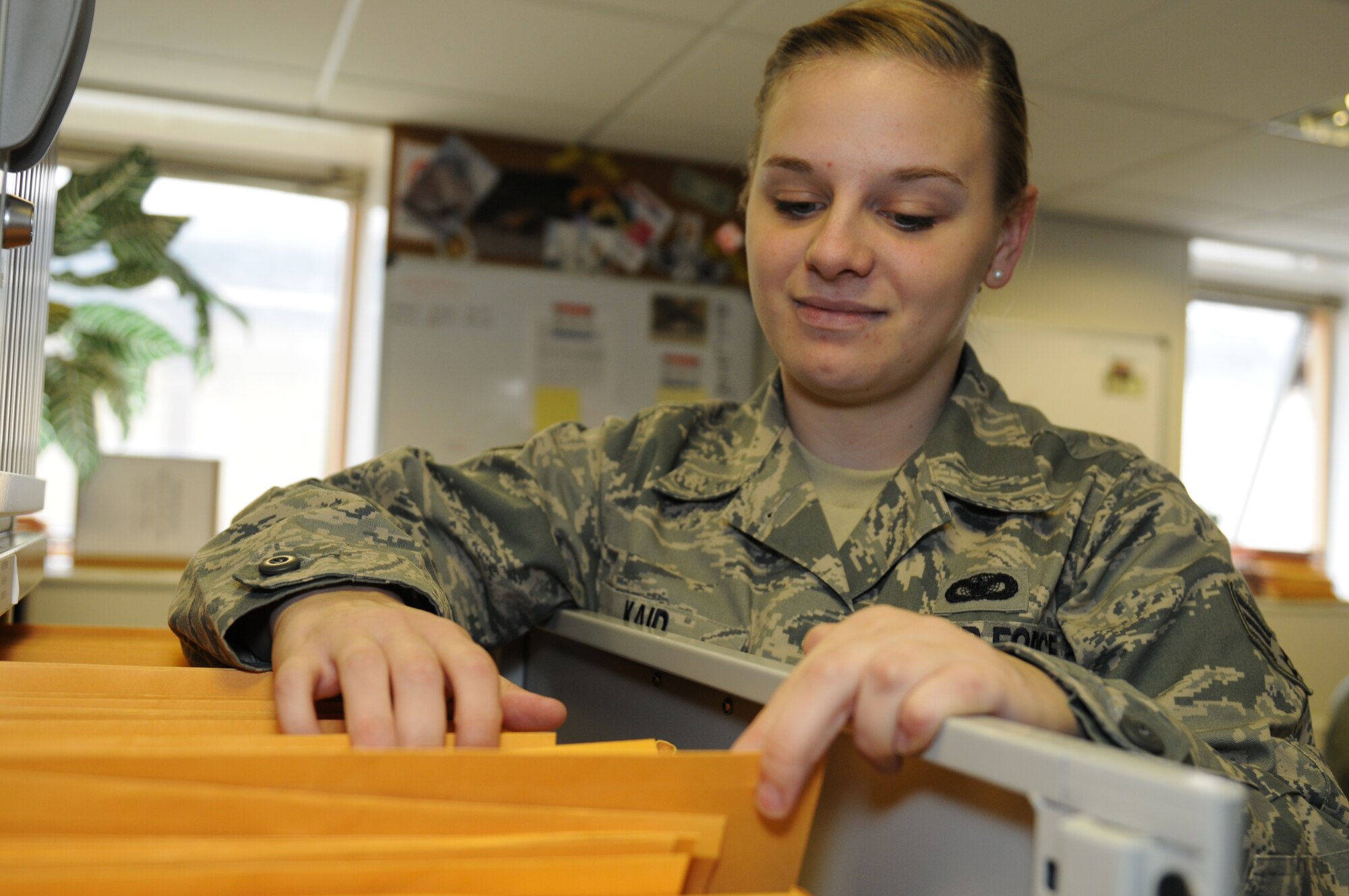 ROYAL AIR FORCE LAKENHEATH, England - Senior Airman ley Kaid, 48th Security Forces SquadronReports and analysis clerk, files papers, Oct. 12, 2011. Kaid was nominated for a Liberty Spotlight because she displays the core value of "Excellence in All We Do". (U.S. Air Force photo by Airman Cory Payne) 
