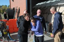 Airman 1st Class Christopher Reid, Airman Andrew Peterson, Airman 1st Class Steve Garwood Airman 1st Class Eliza Granados and Airman Shaina Kubissa, all with the 90th Missile Security Forces Squadron, act as the walking wounded during a base exercise here Sept. 21. (U.S. Air Force photo by Blaze Lipowski)