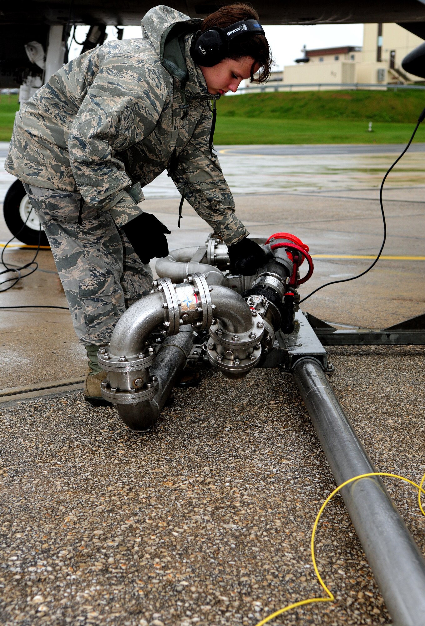SPANGDAHLEM AIR BASE, Germany – Airman 1st Class Heather Dixon, 52nd Logistics Readiness Squadron fuels apprentice, prepares to lift a Type-4 hydrant system to refuel an A-10 Thunderbolt II during hot-pit refueling here Oct. 13. Hot-pit refueling saves time, manpower and equipment usage by using a Type-4 hydrant system to refuel aircraft while they are still running between training missions. (U.S. Air Force photo/Airman 1st Class Matthew B. Fredericks)