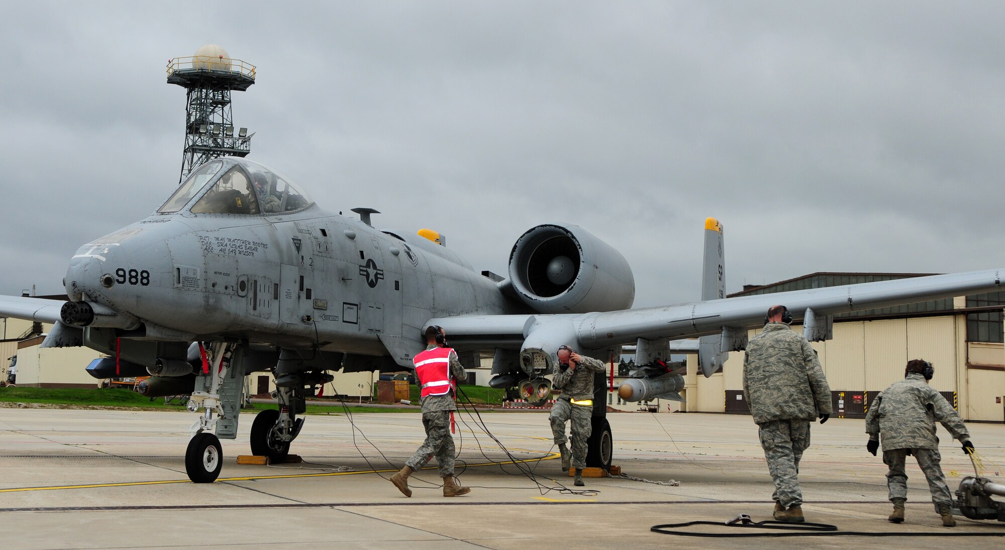 SPANGDAHLEM AIR BASE, Germany – Airmen from the 52nd Logistics Readiness Squadron Fuels Management Flight and the 52nd Aircraft Maintenance Squadron work together to refuel an A-10 Thunderbolt II during hot-pit refueling here Oct. 13. Hot-pit refueling saves time, manpower and equipment usage by using a Type-4 hydrant system to refuel aircraft while they are still running between training missions. (U.S. Air Force photo/Airman 1st Class Matthew B. Fredericks)