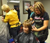 LAUGHLIN AIR FORCE BASE, Texas—Master Sgt. Monica Desjardins, 47th Medical Operations Squadron, donates her hair to be used in wigs for cancer patients. Laughlin’s Health and Wellness Center held a Breast Cancer Awareness Luncheon at Club XL Oct. 6 to educate the base on breast cancer and promote early detection. (U.S. Air Force photo/ 2nd Lt. Angela Martin) 