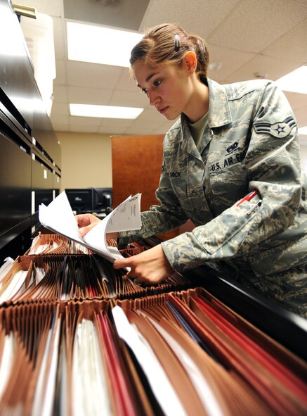 U.S. Air Force Airman 1st Class Katharina Helmick, 20th Maintenance Operations Squadron dedicated aircraft maintenance scheduler, looks through aircraft jacket files to find previous time extensions, Shaw Air Force Base, S.C., Oct. 12, 2011.  In order for the flight line to run smoothly there are a number of routine inspections that need to be fulfilled. One is aircraft maintenance checks, Helmick?s job is ensure all aircraft maintenance inspections are up-to-date. (U.S. Air Force photo by Airman 1st Class Tabatha Duarte/Released)
