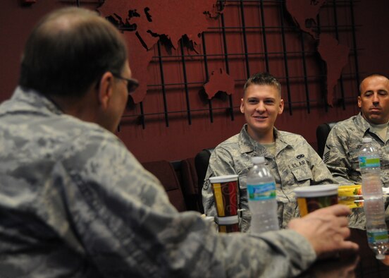 Airman 1st Class James Snider from the 919th Aircraft Maintenance Squadron poses a question to Lt. Gen. Charles E. Stenner Jr., the chief of the Air Force Reserve and commander of Air Force Reserve Command, during a special breakfast meeting for a group of 919th Special Operations Wing enlisted Airmen Oct. 6 at Duke Field, Fla.  Stenner visited Duke Field during a whirlwind East Coast Tour to more than a dozen of his Air Force Reserve units.  (U.S. Air Force photo/Tech. Sgt. Cheryl Foster) 