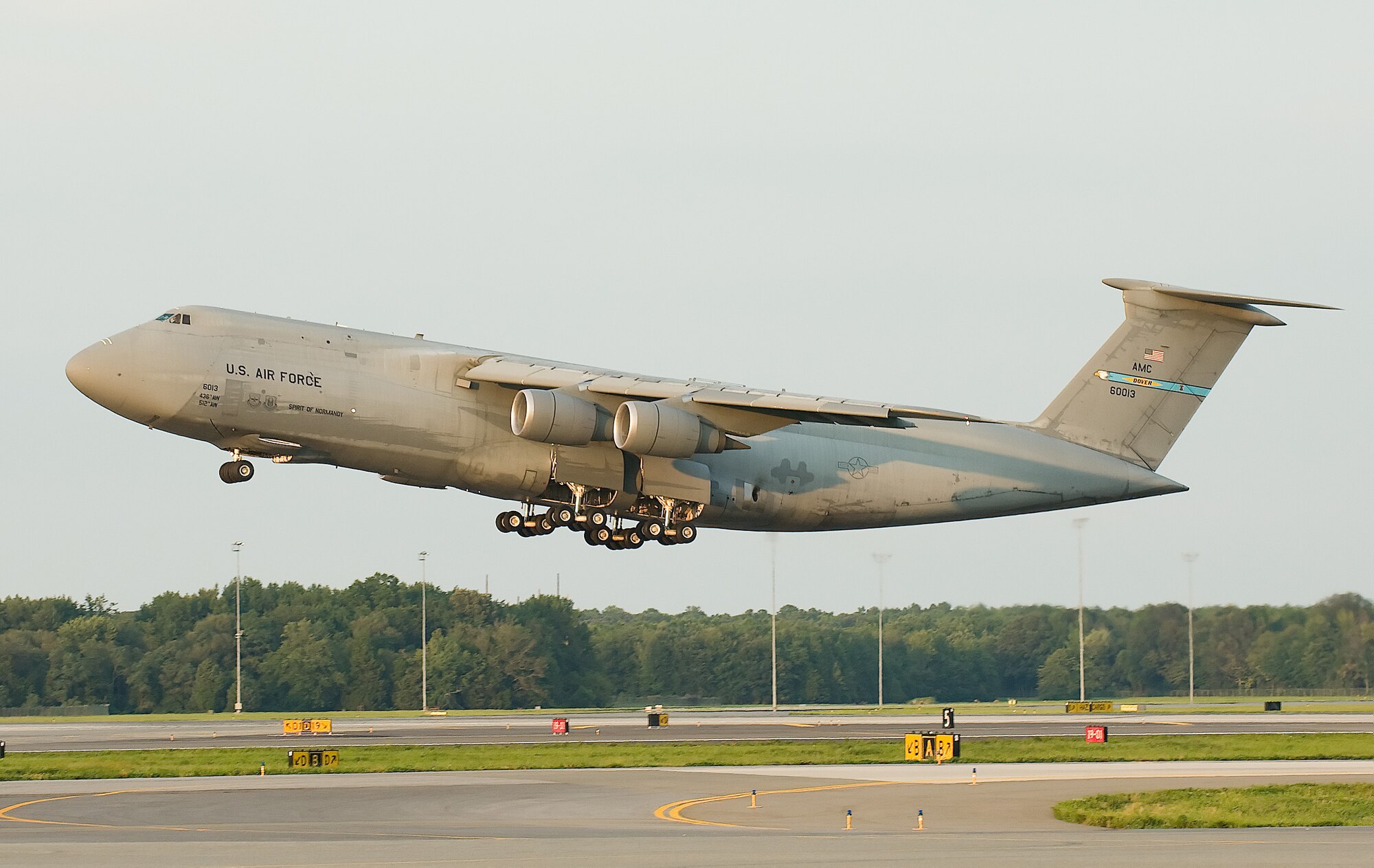 A C-5 Galaxy aircraft becomes airborne during a dignified transfer, Aug. 24, 2009. The C-5 is one of the largest aircraft in the world and the largest airlifter in the Air Force inventory. (U.S. Air Force photo/Jason Minto)