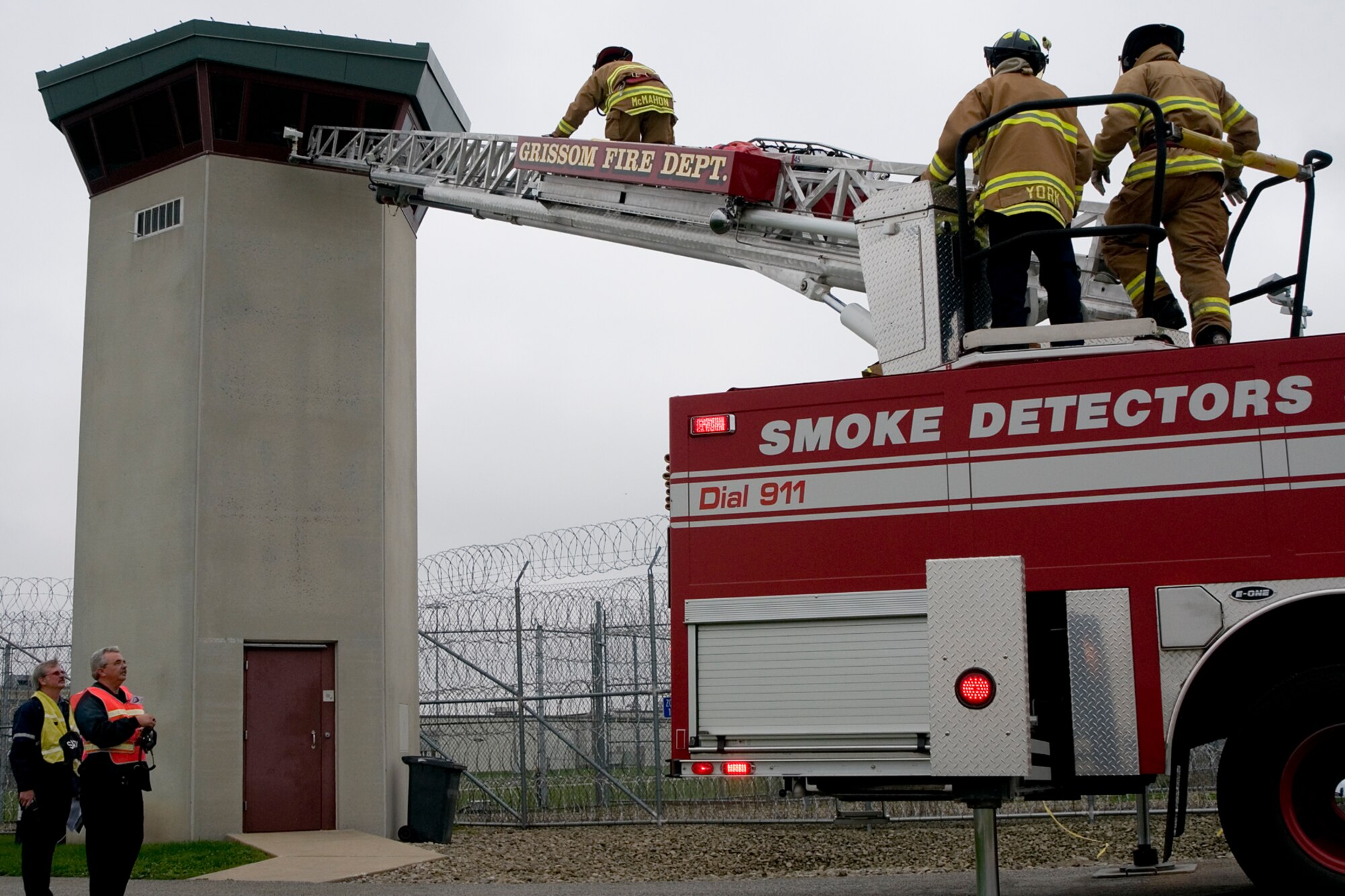 GRISSOM AIR RESERVE BASE, Ind. -- Firefighters from Grissom rescue a simulated injured guard from a tower at the Miami Correctional Facility. The Grissom Fire Department took part in an emergency response exercise scenario where an airplane crashed on the perimeter of the prison. GFD responds to emergencies in the local area outside of the base as part of a mutual aid agreement. (U.S. Air Force photo/Senior Airman Andrew McLaughlin)
