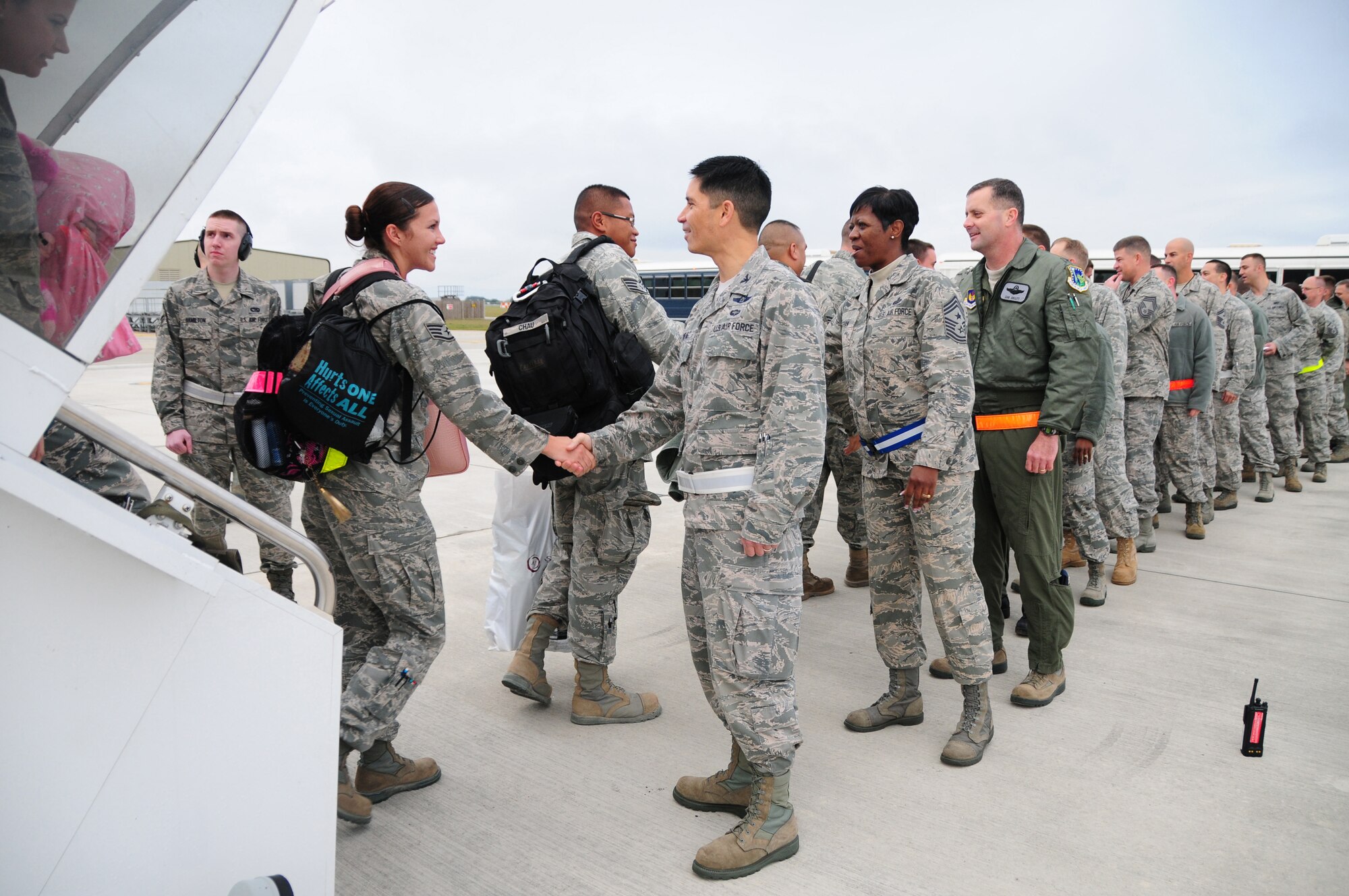 ROYAL AIR FORCE LAKENHEATH, England - Members of the 493rd Fighter Squadron and 748th Aircraft Maintenance Squadron are greeted by Col. John Quintas, 48th Fighter Wing commander, Chief Master Sgt. SaRita Lathan, 48th FW command chief, Col. Daniel Orcutt, 48th Operations Group commander, and other wing leadership after returning from deployment to Southwest Asia, Oct. 13, 2011. During the deployment, the squadrons? primary mission was to provide theater security for the region. (U.S. Air Force photo by Senior Airman Lausanne Morgan) 