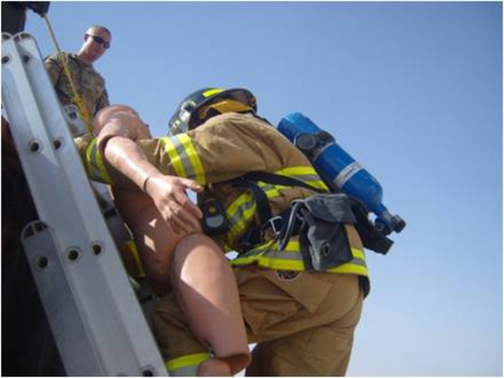 Firefighters learn victim removal techniques with extension ladders while conducting level-three fire training recently. The purpose of the training explained firefighters was to add some tools to the AAF firemen toolbox that will provide and assist them in rescuing victims from second story buildings as well as help them to raise and lower equipment during fire ground operations. This training speeds up response reactions and allows for safe fire ground operations they said. (U.S. Air Force courtesy photo)
