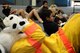 ANDERSEN AIR FORCE BASE, Guam—Sparky the Dog does sit-ups with fourth-grade children at Andersen Elementary School here, Oct. 13. Sparky and Andersen Fire department members visited the school to teach children about fire prevention during Fire Prevention Week. (U.S. Air Force photo by Senior Airman Benjamin Wiseman/Released)