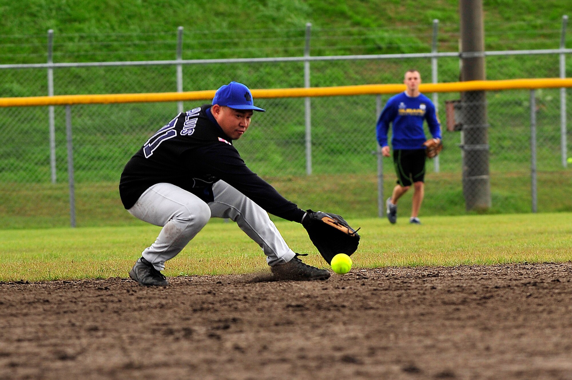 MISAWA AIR BASE, Japan -- Francis San Luis, 35th Security Forces Squadron, snags the ball in the final softball game during the 35th Fighter Wing Sports Day here Oct. 7. The 35 FW held a sports day to promote physical fitness, teamwork, competition, sportsmanship and esprit de corps. The day was kicked off with a 3-mile run followed by various sporting events to include relay races, basketball, softball, ultimate Frisbee, soccer and a readiness competition. Approximately 14 units from the base formed teams to participate in each event. (U.S. Air Force photo by Staff Sgt. Nathan Lipscomb)