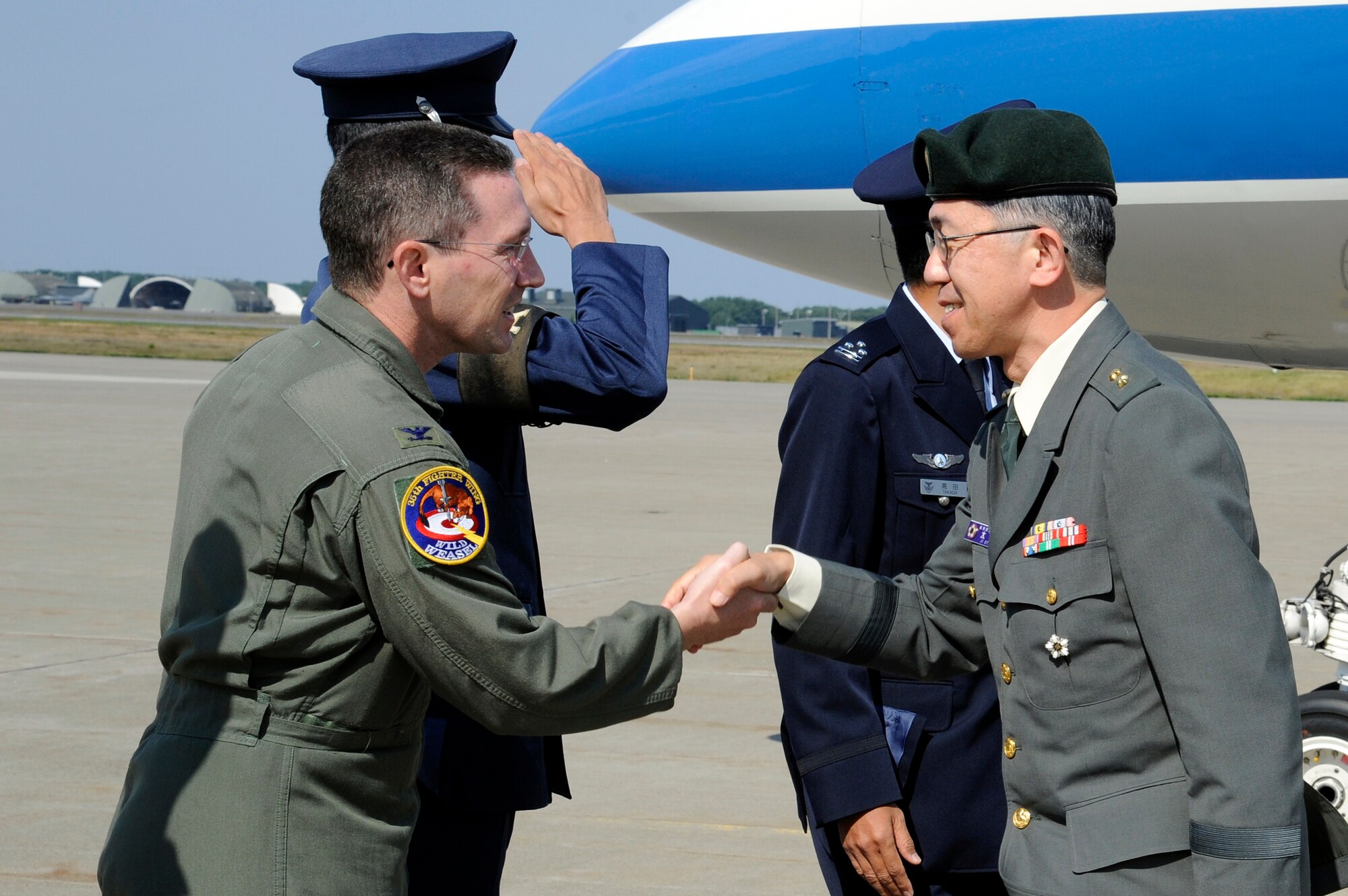 MISAWA AIR BASE, Japan - U.S. Air Force Col. Michael D. Rothstein, left, 35th Fighter Wing commander, greets Maj. Gen. Makiya Ota, Director Japan Joint Staff, upon his arrival here Oct. 11. General Ota traveled to Misawa Air Base to tour base facilities and visit with the Japan Air Self-Defense Force. (U.S. Air Force photo/Tech. Sgt. Marie Brown)