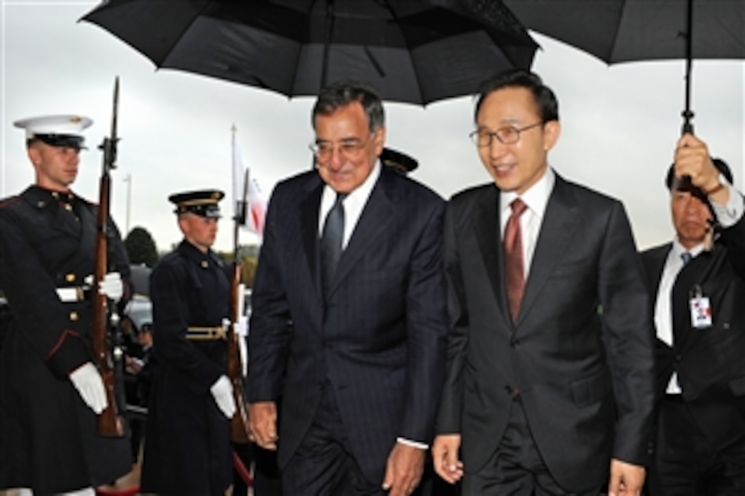 Secretary of Defense Leon Panetta, left, escorts Republic of Korea President Lee Myung-bak through an honor cordon and into the Pentagon in Arlington, Va., on Oct. 12, 2011.
Panetta and Lee will meet with members of the Joint Chiefs of Staff and senior Department of Defense leaders in the Joint Chiefs conference room commonly known as The Tank.  
