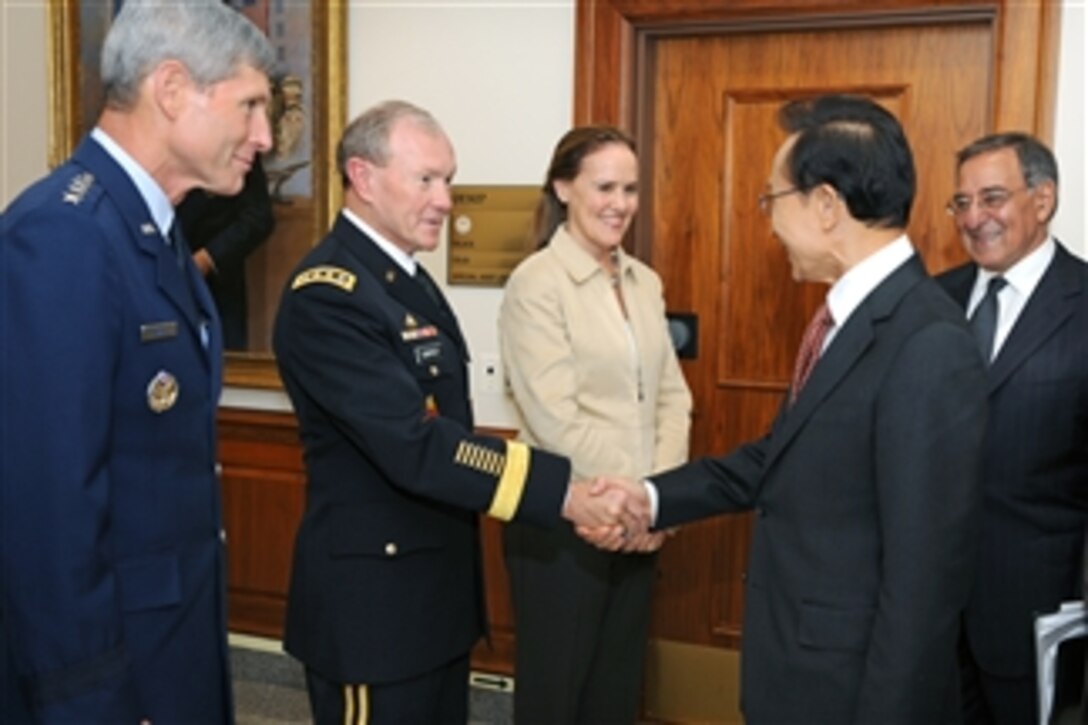 South Korean President Lee Myung-bak shakes hands with Chairman of the Joint Chiefs of Staff Gen. Martin E. Dempsey, U.S. Army, shortly after his arrival at the Pentagon in Arlington, Va., on Oct. 12, 2011. Lee and Panetta will meet with members of the Joint Chiefs of Staff and senior Department of Defense leaders in the Joint Chiefs conference room commonly known as The Tank.  Also in the receiving line is Under Secretary of Defense for Policy Michele Flournoy, and Air Force Chief of Staff Gen. Norton A. Schwartz.  