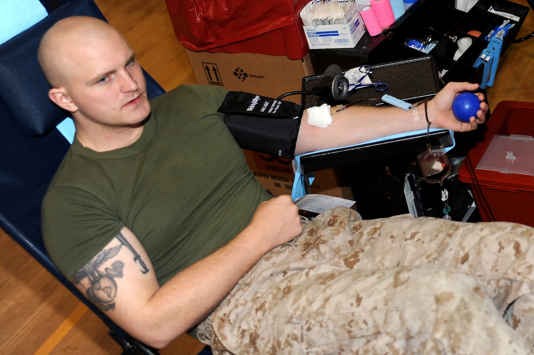 Lance Cpl. Corbett Smith, Company B police sergeant, gives blood during a blood drive at Marine Barracks Washington Oct. 13, 2011. Approximately 50 pints of blood were collected from the Barracks.
