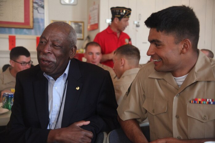 Ed Flowers, a member of the Marines’ Memorial Club, shares his experiences with Cpl. Alfred Prasad, a launcher chief with 5th Battalion, 11th Marine Regiment, during San Francisco Fleet Week, Oct. 10. Flowers led the service members through the streets of San Francisco, stopping at the Marines’ Memorial Club and several restaurants. (Marine photo by Lance Cpl. Timothy J. Lenzo)