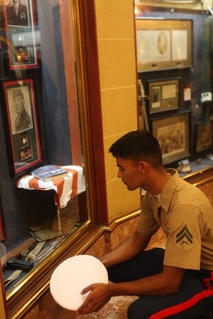 Cpl. Alfred Prasad, a launcher chief with 5th Battalion, 11th Marine Regiment, reads about the Korean War during a historical tour of the Marines’ Memorial Club in San Francisco Oct. 10. The American Legion provided the tour along with lunch to Marines and sailors from the USS Bonhomme Richard. During Fleet Week, service members participated in multiple events, demonstrating the amphibious nature of the Navy-Marine Corps team.