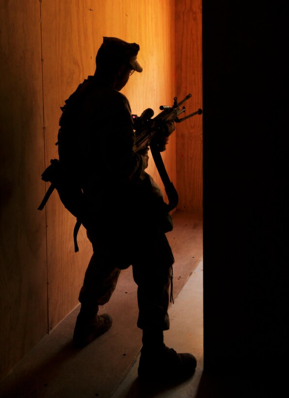 Private First Class Carlos Figueroa, a rifleman with 2nd Platoon, Bravo Company, 1st Battalion, 2nd Marine Regiment, provides security during a simulated raid as part of the Vertical Assault Course at the Military Operations in Urban Terrain training center aboard Camp Lejeune, N.C., Oct. 13th, 2011. The Vertical Assault Course is taking place Oct. 10-21 to provide Marines and Sailors of Bravo Co. familiarization with air operations for their upcoming deployment as the Battalion Landing Team for the 24th Marine Expeditionary Unit. The company serves as the battalion’s vertical assault element, meaning they insert and extract from areas by helicopter.