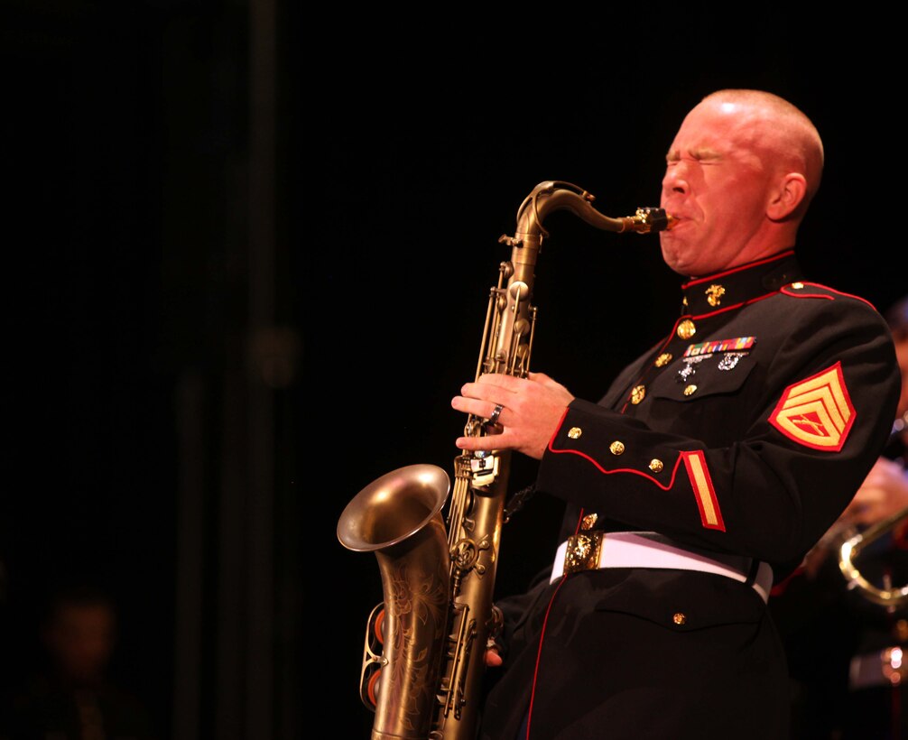 Staff Sgt. Jedidiah S. Koch, saxophone player, 2nd Marine Division Band, plays a solo for hundreds of crowd members at the Klein Auditorium in Bridgeport Conn., Oct. 8. The band traveled to Bridgeport for multiple Columbus Day celebrations held by the city.