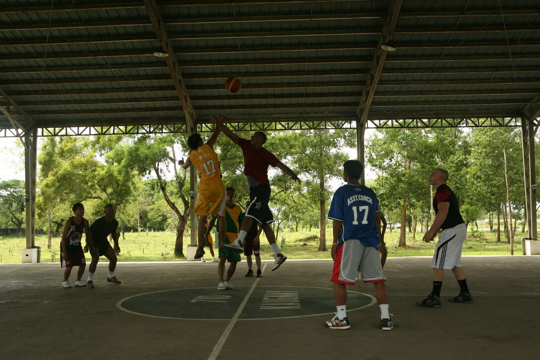 U.S. Marines and sailors attached to 3rd Marine Expeditionary Brigade play basketball with Filipino students from Barangay Military High School at Fort Magsaysay, Oct. 14. U.S. Navy chaplain Lt. Kyu Lee and Philippine Army chaplain Maj. Rex Armena put the basketball game together for a joint community relations opportunity. “We got to spend time in a relaxed environment, rather than a training one,” said Petty Officer 3rd Class Jason A. Gramley, a religious program specialist attached to 3rd MEB. “We were able to build relationships with the locals.” The U.S. armed forces are here in support of the annual Amphibious Landing Exercise. PHIBLEX is an annual bilateral training exercise held throughout the Republic of the Philippines. The intent of the exercise is to improve interoperability, combat readiness and enhance security cooperation throughout the region.