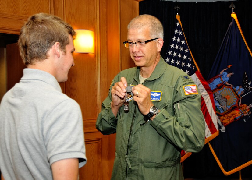 The Commander of the 94th Airlift Wing Col. Timothy E. Tarchick, Dobbins Air Reserve Base, Ga. gives advice to future U.S. Marine Corps Alex Delia at the Buffalo Military Entrance Processing Station October 14, 2011 Niagara Falls, NY . Col. Tarchick was visiting the Niagara Falls Air Reserve Station with Civic leaders from Dobbins Air Reserve Base, Ga. (U.S. Air Force photo by Staff Sgt. Joseph McKee)