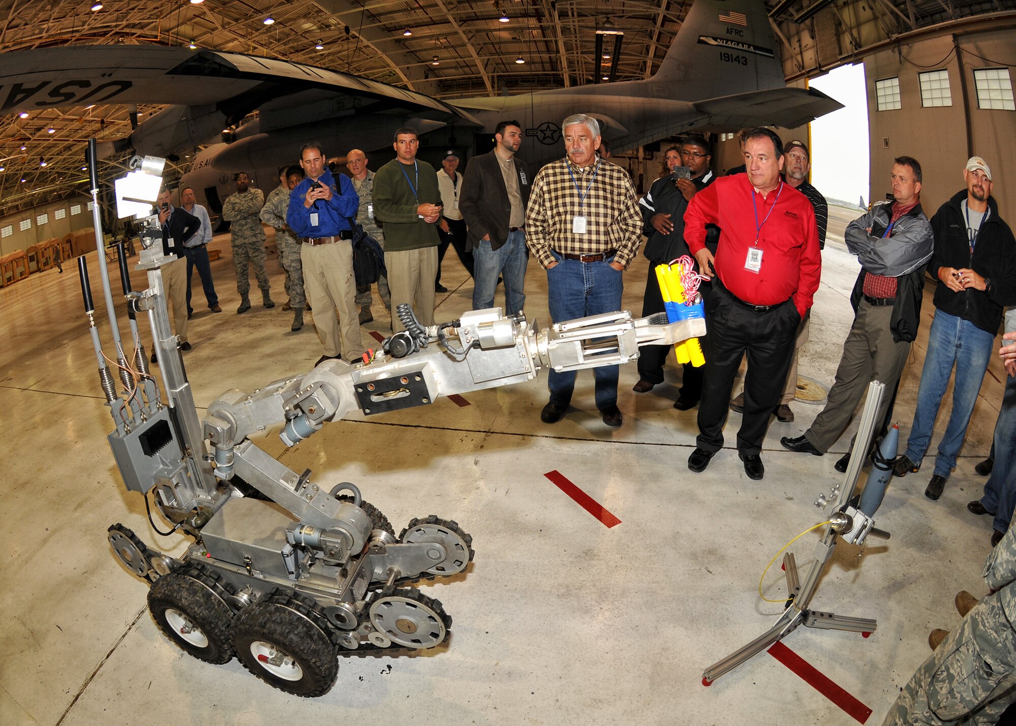 Master Sgt. Keith C. Hartloff, 914th explosive ordnance disposal flight and Robot give an demonstration to civic leaders from Dobbins Air Reserve Base October 14, 2011 Niagara Falls, NY. The civic leaders visited the Niagara Falls Air Reserve Station October 13-14. (U.S. Air Force photo by Staff Sgt. Joseph McKee)