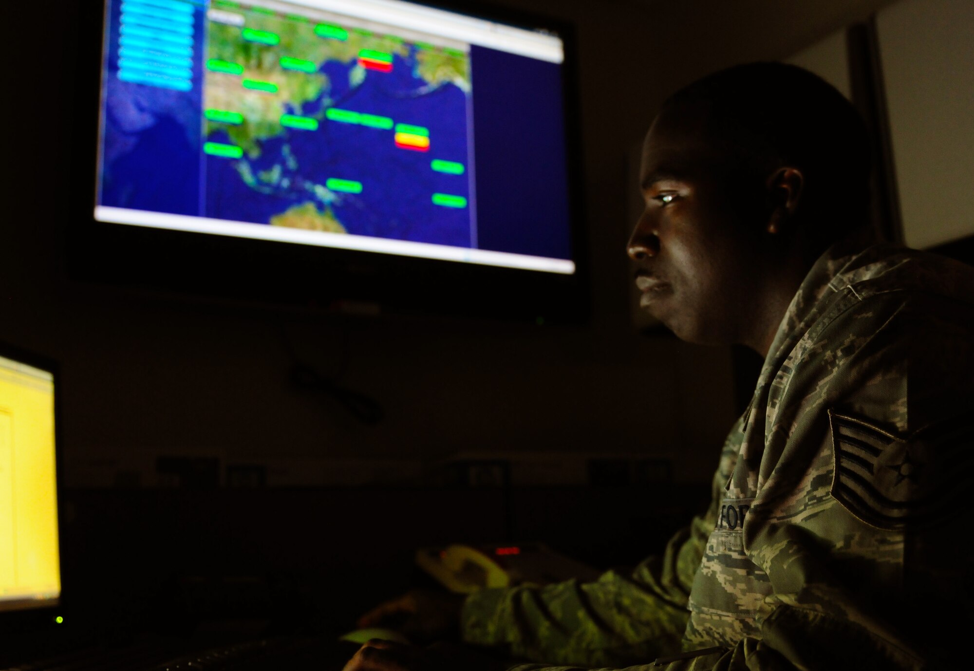 TSgt. Brian Little, 13th Air Force?s Communications and Information directorate senior operations controller, monitors the U.S. Air Forces Central (AFCENT) Communications and Information directorate?s heads up display (HUD).  Little was sent downrange to an undisclosed location in southwest Asia to install and configure a HUD similar to the one developed and used by 13 AF?s AFFOR Communications Control Center (ACCC) to track communications events in the PACAF theater. (U.S. Air Force photo/ Tech Sgt. Aries D. Early)