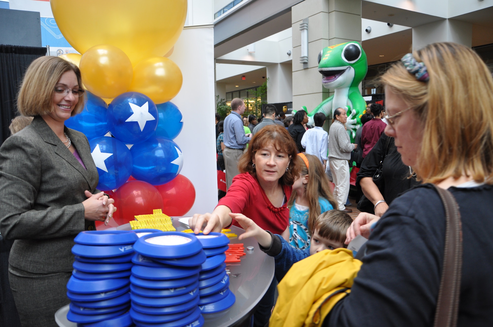 April Rowden, the U.S. Air Force Trademark and Licensing program chief, provides information to booth visitors during the 2011 U.S. Patent and Trademark Office National Trademark Expo Oct. 14, 2011 at the USPTO headquarters building in Alexandria, Va. The trademark and licensing program represented the Air Force at the expo, displaying a booth and providing information about the program. (U.S. Air Force photo by Staff Sgt. Alex Martinez)