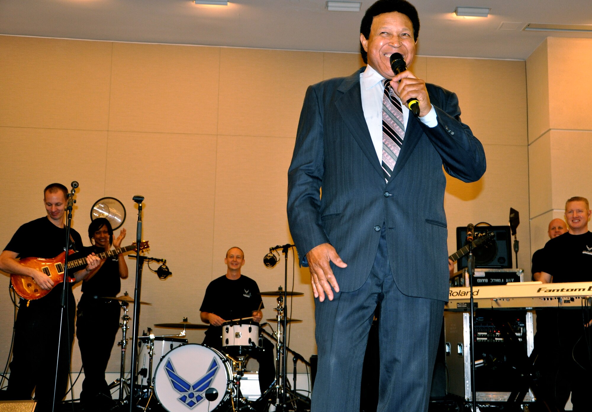 Music artist Chubby Checker sings and performs “The Twist” along with “Max Impact,” a U.S. Air Force band during the opening ceremony of the 2011 U.S. Patent and Trademark Office National Trademark Expo Oct. 14, 2011 in Alexandria, Va. The U.S. Air Force Trademark and Licensing program provided information at its booth about the more than 7,000 marks the Air Force possesses. (U.S. Air Force photo by Staff Sgt. Alex Martinez)