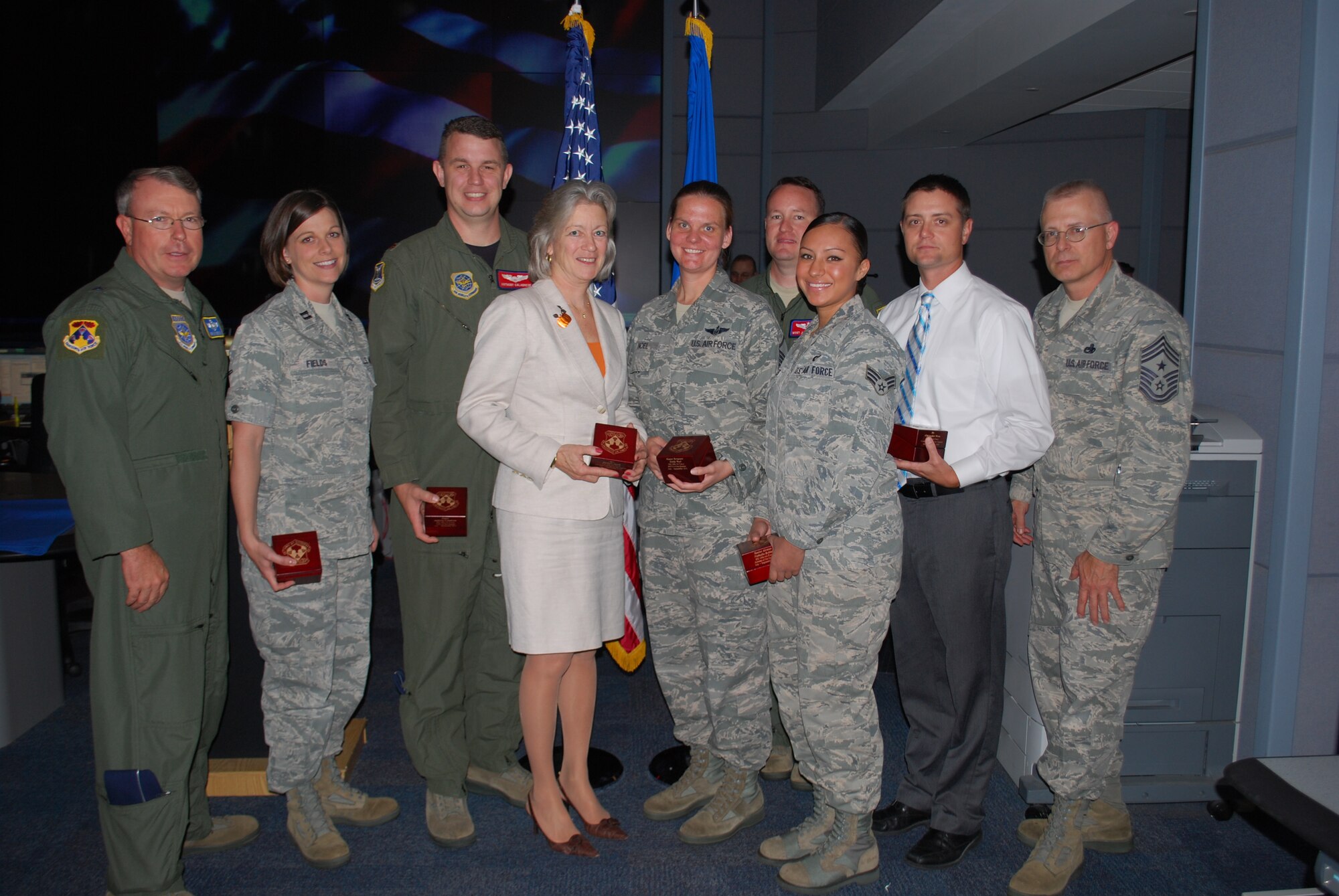 18th Air Force Vice Commander Brig Gen. Bryan Benson (far left) and18th Air Force Command Chief Chief Master Sgt. Jeffrey Williams (far right), with winners of the Headquarters, 18th Air Force Third Quarter Awards here Oct. 13. From left to right: Capt. Cynthia Fields (Company Grade Officer of the Quarter), Maj. Anthony Calabrese (Field Grade Officer of the Quarter), Barbara Jacob (Civilian of the Quarter, Category III), Master Sgt. Emily Noel (Senior NCO of the Quarter), Tech Sgt. Jason Schaub (NCO of the Quarter), Senior Airman Nathalia Robles (Junior Enlisted Member of the Quarter), and Christopher Wren (Civilian of the Quarter, Category II). (U.S. Air Force Photo by 1st Lt. Marshel Slater/Released.)