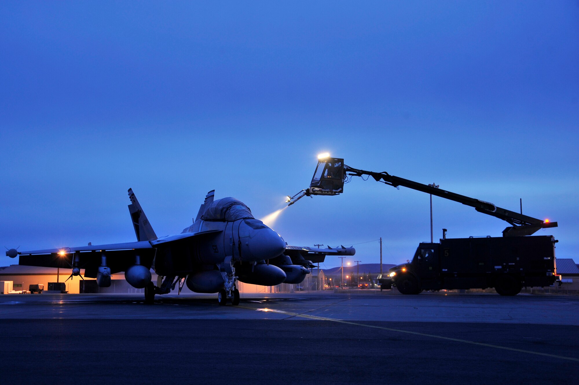 A U.S. Navy EA-18G Growler gets de-iced during exercise RED FLAG-Alaska 12-1 Oct. 13, 2011, Eielson Air Force Base, Alaska. RF-A provides U.S. and allied pilots, aircrews and operational support personnel the opportunity to train and improve their air combat skills in preparation for a myriad of worldwide contingencies. (U.S. Air Force photo by Staff Sgt. Christopher Boitz/Released)