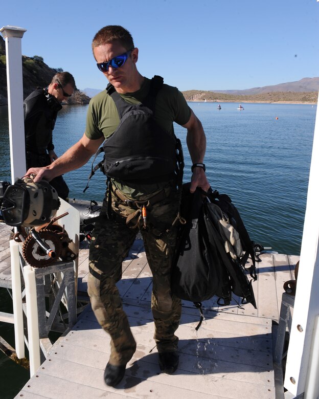 LAKE ROOSEVELT, Ariz. – An Air Force pararescueman walks with his gear during the Angel Thunder exercise here Oct. 11. Approximately 1,400 U.S. Military, federal and state employees, and coalition forces are participating in the fifth-annual Angel Thunder exercise, the largest military combat search and rescue exercise in the world. (U.S. Air Force photo/Airman 1st Class Christine Griffiths)