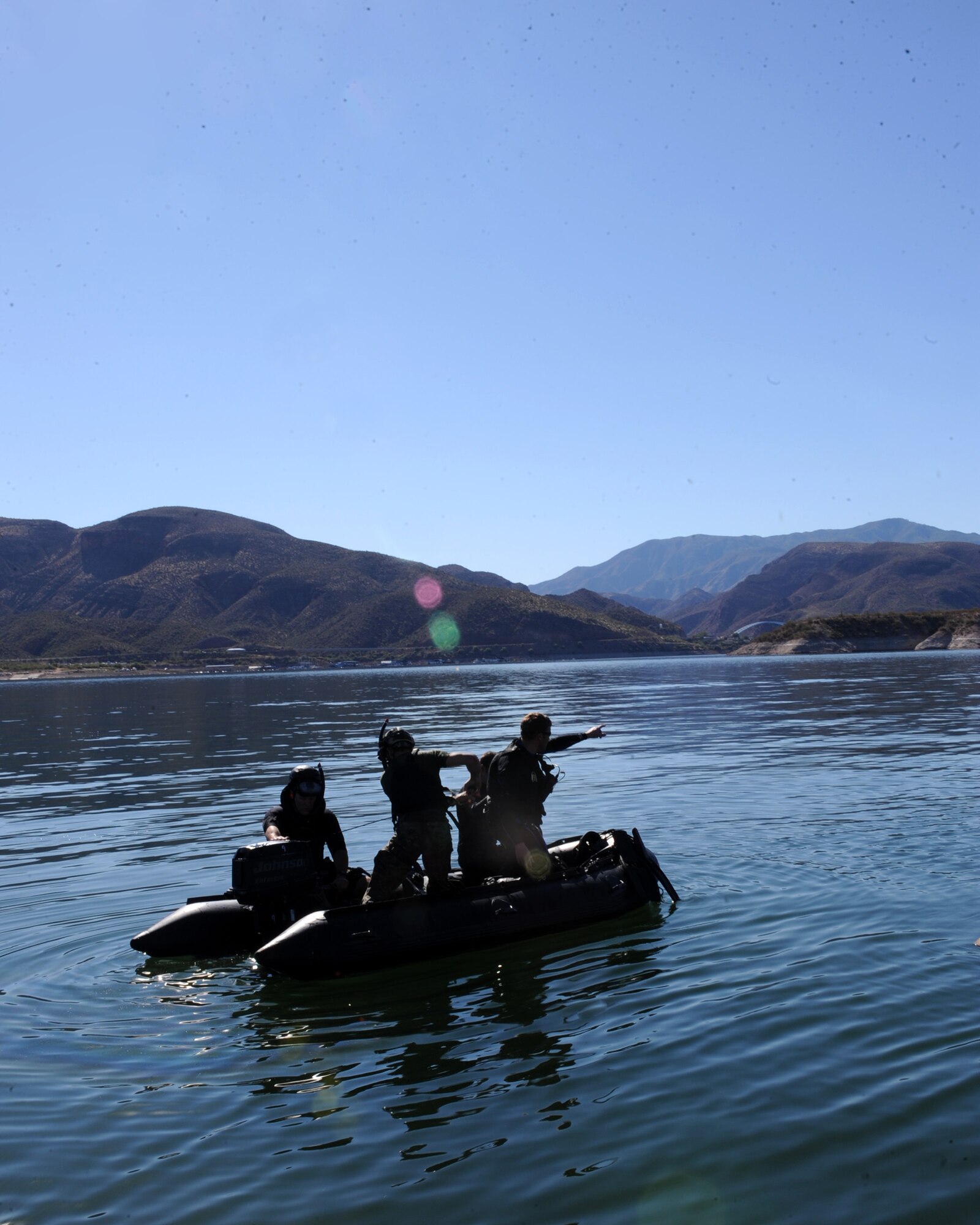 LAKE ROOSEVELT, Ariz. – Air Force pararescuemen try starting their boat after repelling out of HH-60 Pave Hawk during the Angel Thunder Exercise here Oct. 11. Approximately 1,400 U.S. Military, federal and state employees, and coalition forces are participating in the fifth annual Angel Thunder exercise, the largest military combat search and rescue exercise in the world. (U.S. Air Force photo/Airman 1st Class Christine Griffiths) Approximately 1,400 U.S. Military, federal and state employees, and coalition forces are participating in the fifth-annual Angel Thunder exercise, the largest military combat search and rescue exercise in the world. (U.S. Air Force photo/Airman 1st Class Christine Griffiths)