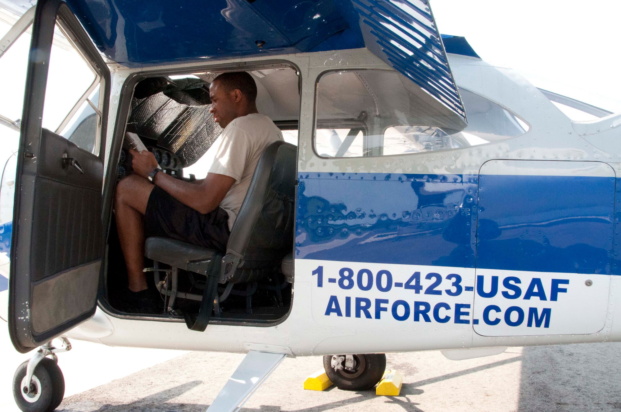 1st Lt. Clarence Garden, executive officer at Air Force Mortuary Affairs Operations, reviews a pre-flight checklist on a Cessna 172 at the Dover Air Force Base Aero Club Sept. 30, 2011. Garden took lessons to fulfill his childhood dream of becoming a pilot. (U.S. Air Force photo/Tech. Sgt. Marvin Moore)