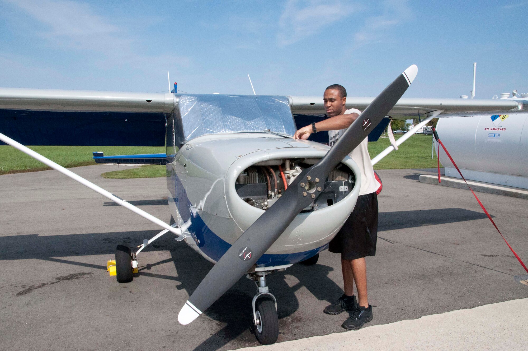 1st Lt. Clarence Garden, executive officer at Air Force Mortuary Affairs Operations, checks the oil level of a Cessna 172 at the Dover Air Force Base Aero Club before a flight Sept. 30, 2011. Garden took lessons to fulfill his childhood dream of becoming a pilot. (U.S. Air Force photo/Tech. Sgt. Marvin Moore)