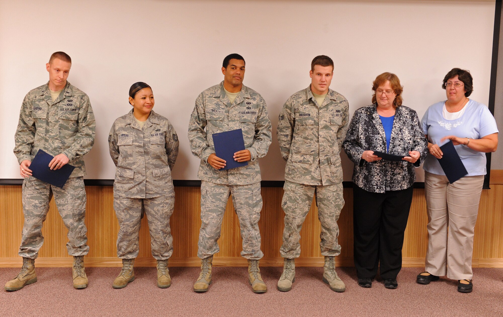 Members from the 7th Comptroller Squadron are selected for the superior performer award for the wing staff agencies, Oct. 13, 2011, at Dyess Air Force Base, Texas. Every month each group selects a person or team who has shown superior performance to be recognized in front of wing leadership. (U.S. Air Force photo by Airman 1st Class Peter Thompson/Released)