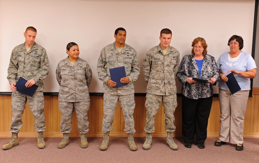 Members from the 7th Comptroller Squadron are selected for the superior performer award for the wing staff agencies, Oct. 13, 2011, at Dyess Air Force Base, Texas. Every month each group selects a person or team who has shown superior performance to be recognized in front of wing leadership. (U.S. Air Force photo by Airman 1st Class Peter Thompson/Released)