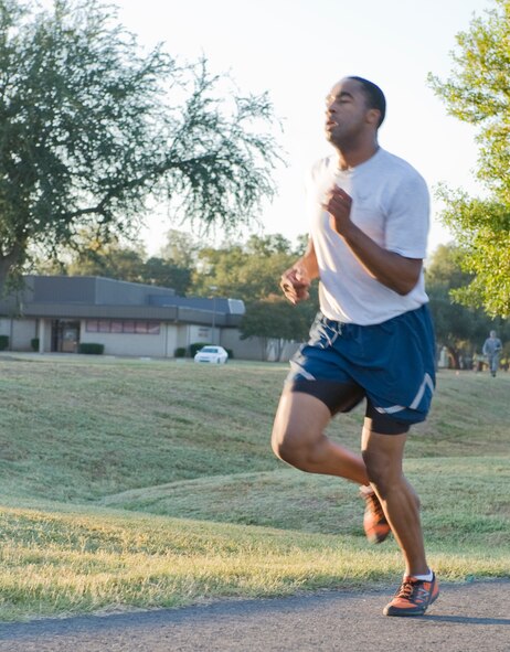Airman 1st Class Ernest Sereal, 2nd Civil Engineer Squadron, finishes the Celebrate Barksdale fun run on Barksdale Air Force Base, La., Oct. 14. The event kicked off a day of fun activities hosted by the Shreveport-Bossier Military Affairs Council, which included a picnic on the Chapel 1 grounds. (U.S. Air Force photo/Airman 1st Class Benjamin Gonsier)(RELEASED)