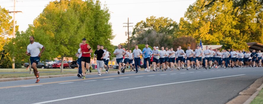Members of Team Barksdale begin the Celebrate Barksdale fun run on Barksdale Air Force Base, La., Oct. 14. The event kicked off a day of fun activities hosted by the Shreveport-Bossier Military Affairs Council (MAC), which included a picnic on the Chapel 1 grounds. The MAC provided numerous prizes which were raffled off at the event. (U.S. Air Force photo/Airman 1st Class Benjamin Gonsier)(RELEASED)