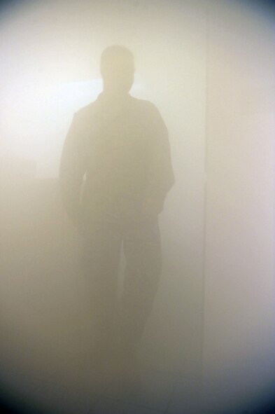 A 7th Civil Engineer Squadron airman fills the ‘smoke house’ with fog to simulate smoke Oct. 12, 2011 during Fire Prevention Week at Dyess Air Force Base, Texas. Fire Prevention Week is geared towards placing emphasis on fire and safety and is structured to reach the maximum amount of people in the Dyess Community. (U.S Air Force photo by Airman 1st Class Jonathan Stefanko/ Released)