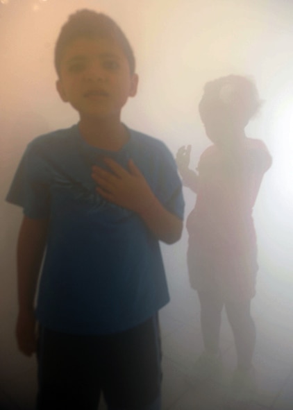 Isaiah Carrillo, 7, from the Hendrix Home for Kids, goes through the ‘smoke house’ with simulated smoke from a fog machine Oct. 12, 2011 during Fire Prevention Week at Dyess Air Force Base, Texas. Fire Prevention Week is geared towards placing emphasis on fire and safety and is structured to reach the maximum amount of people in the Dyess Community. (U.S Air Force photo by Airman 1st Class Jonathan Stefanko/ Released)