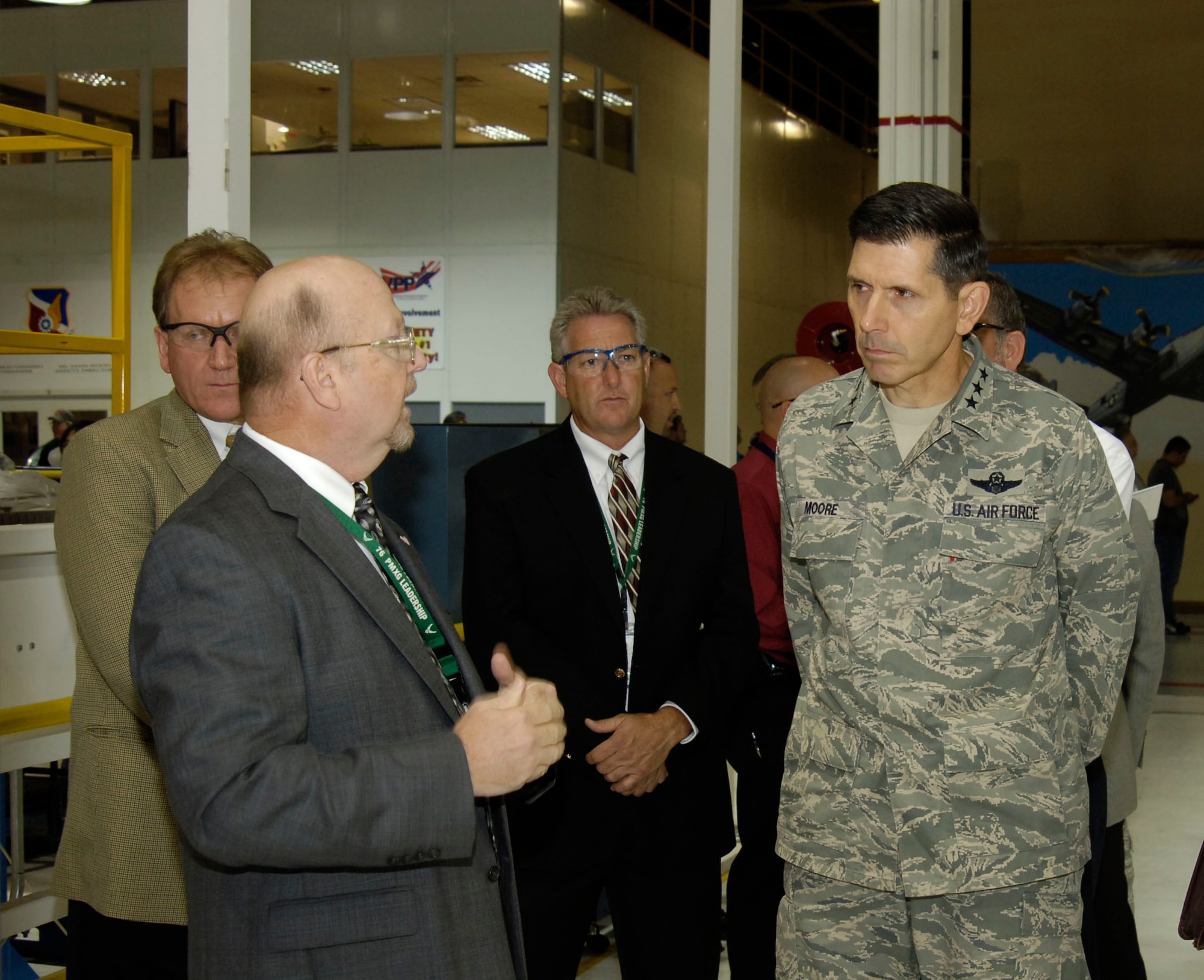 Lt. Gen. C.D. Moore II, Air Force Materiel Command vice commander (right), listens during an F117 engine briefing by Floyd Craft, 547th Propulsion Maintenance Squadron director, at the Oklahoma City Air Logistics Center. General Moore visited Tinker Oct. 5-6 and toured production areas, program offices, test cells and mission support functions. (Air Force photo by Margo Wright)