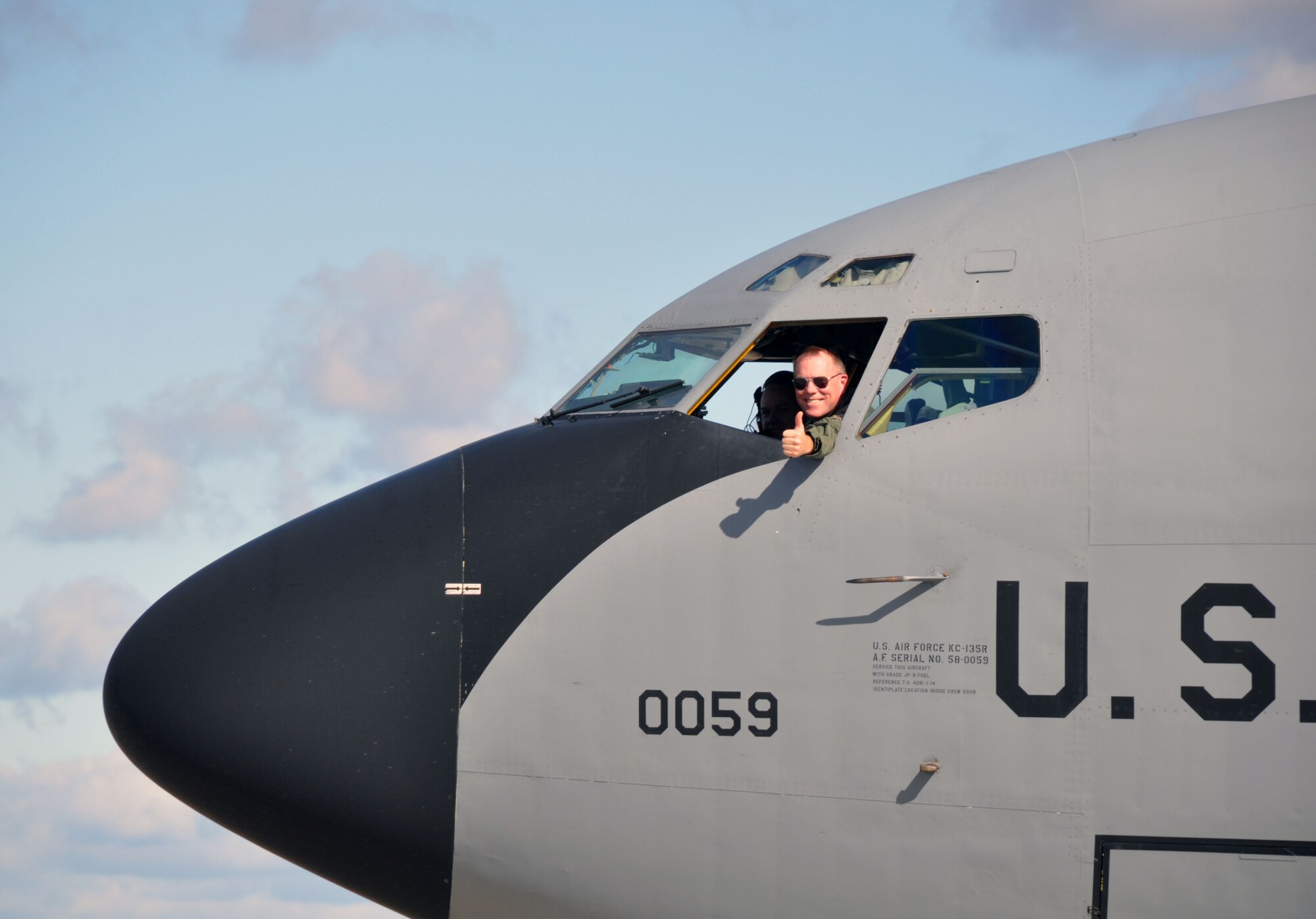 Col. Ted Metzgar, Commander, 128th Air Refueling Wing signals "thumbs up" as he returns from a 4 month long deployment supporting Operation Unified Protector in Western Europe Friday, October 14, 2011 in Milwaukee. (U.S. Air Force photo/Capt. John P. Capra)