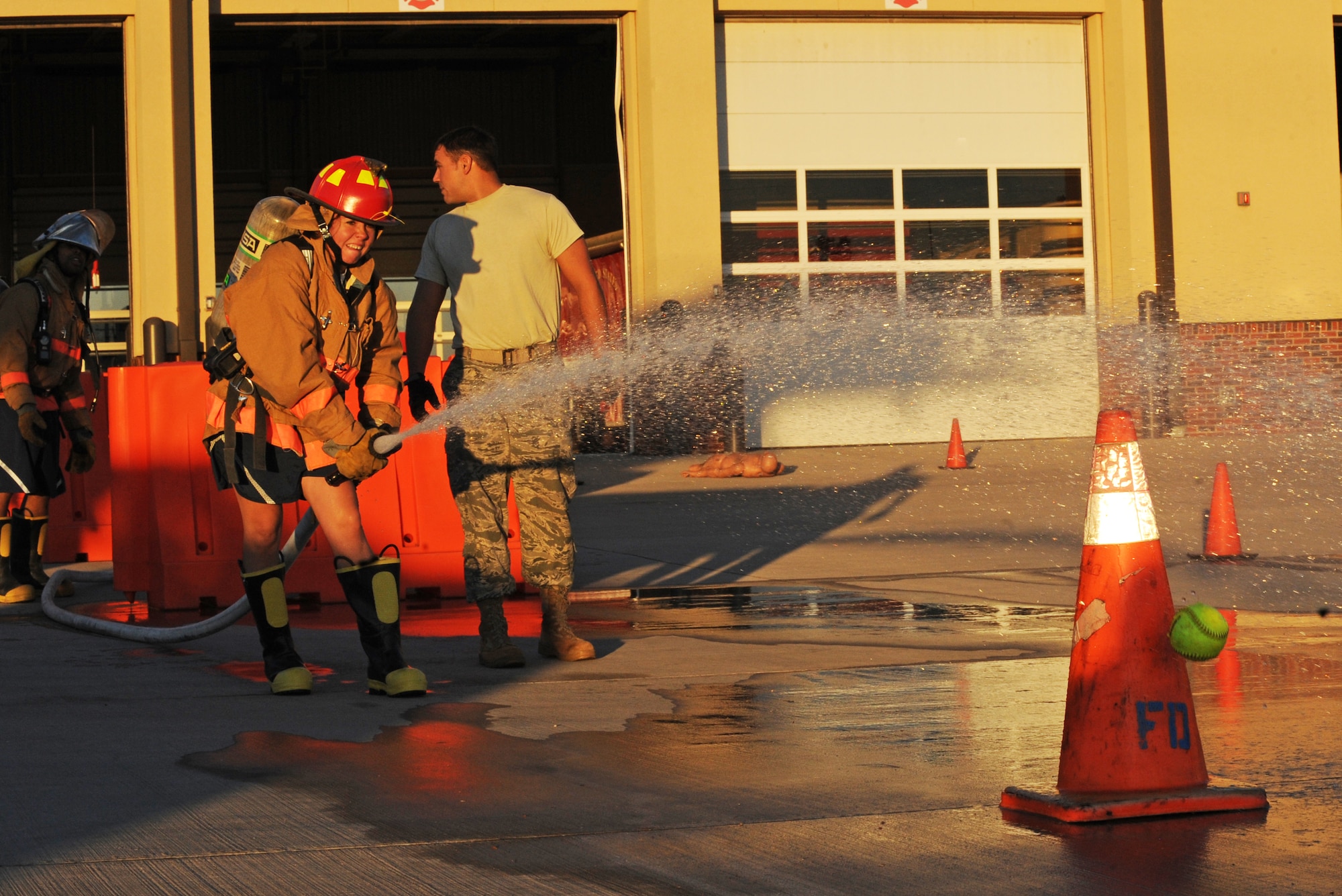 Airman 1st Class Katherine Lambert, 7th Security Forces Squadron, participates in the fire fighter challenge as part of Fire Prevention Week, Oct. 14, 2011, at Dyess Air Force Base, Texas. Fire Prevention Week is geared towards placing emphasis on fire and safety and is structured to reach the maximum amount of people in the Dyess community.  (U.S. Air Force photo by Airman 1st Class Peter Thompson/Released)