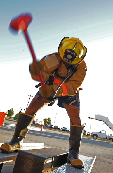 Senior Airman Brittany Ferguson, 7th Security Forces Squadron, participates in the fire fighter challenge as part of Fire Prevention Week, Oct. 14, 2011, at Dyess Air Force Base, Texas. Fire Prevention Week is geared towards placing emphasis on fire and safety and is structured to reach the maximum amount of people in the Dyess community.  (U.S. Air Force photo by Airman 1st Class Peter Thompson/Released)